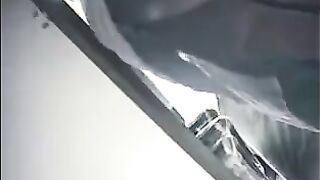 The camera is hidden at the checkout in the store and shoots up skirts