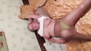 The girl was embarrassed by the flow of milk from her breasts during the photo session