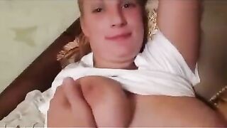 The girl was embarrassed by the flow of milk from her breasts during the photo session