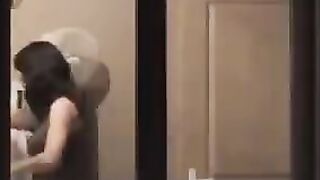 He admires himself in the mirror, standing completely naked in front of it
