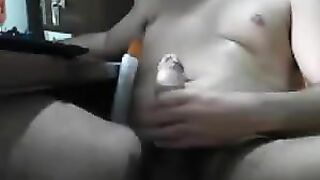 A man masturbates his dick sitting in front of the computer