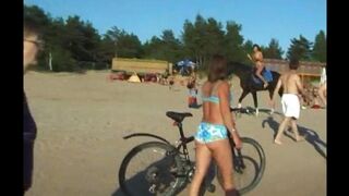 A girl has fun on the beach without any clothes or any shame
