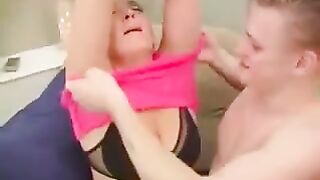 A hot woman is having sex with her son in the chair, showcasing intense passion