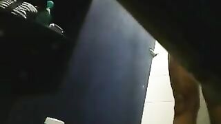 Hidden camera in the shower captures girl's shaved pussy