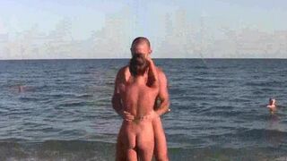 Beach naked acrobats show their skills in the nude on the ocean