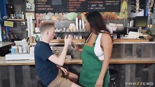 A girl with big tits is working as a barista in the coffee shop