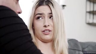 A girl is getting intimate with her stepdad on the couch