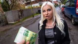 A blonde MILF is getting fucked on the clothes for money