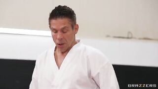 A girl is having sex in an uncomfortable position with her coach