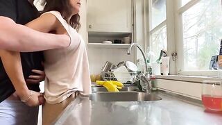 A mature woman with big breasts was fucked in the kitchen