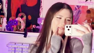 A girl caressed herself with a mirror, showcasing her alternative allure