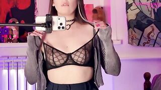 A girl caressed herself with a mirror, showcasing her alternative allure