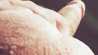 The hand slides up and down the barrel in a sensual rhythm
