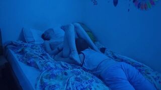 The couple has sex under the neon lights in the bedroom