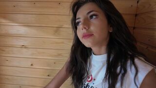 A stunning brunette is eager to shed her clothes and get closer in the sauna