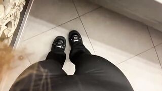 A girl was jerking off in the public toilet, showcasing her daring side