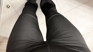 A girl was jerking off in the public toilet, showcasing her daring side