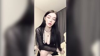 A girl with a pump nipple sucks her finger and caresses herself