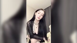 A girl with a pump nipple sucks her finger and caresses herself
