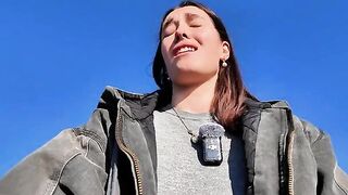 Hot brunette babe masturbating on a public beach